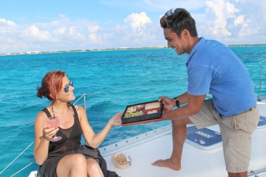 Luxury Sailing Experience to Isla Mujeres with Lunch & Open Bar