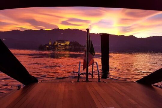 Private romantic sunset cruise on Lake Orta sipping wine on board