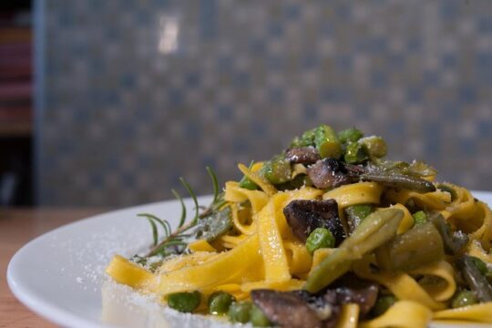 Dining experience at a local's home in Pisa with cooking demo