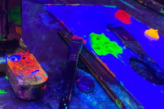 Paint a neon fluorescent picture while drinking unlimited wine