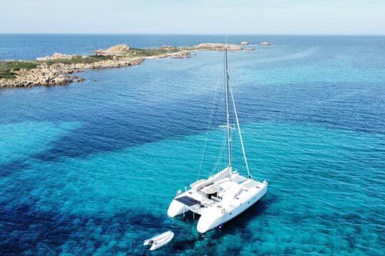 Private Catamaran Tour of La Caletta Capo Comino and Isola Rossa