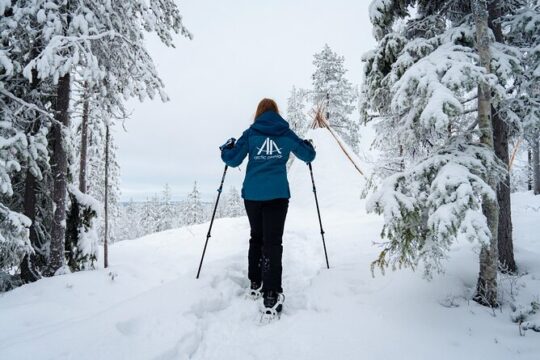Snowshoeing in snowy forest with local guide